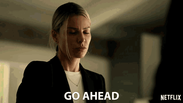 a woman in a suit says go ahead in a netflix advertisement