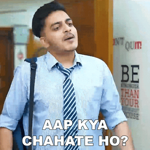 a man in a blue shirt and tie is asking " aap kya chitate ho "