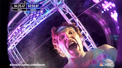 a man is screaming in front of a screen that says nbc