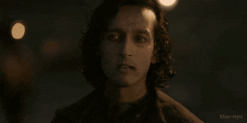 a close up of a man 's face with khar-mp4 written on the bottom right