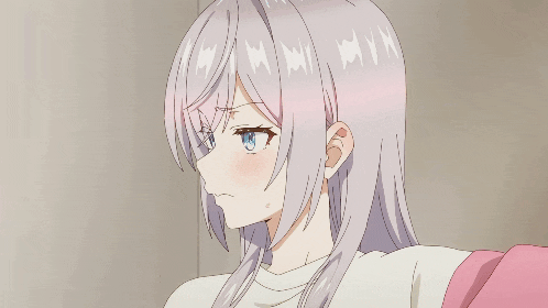 a close up of a girl 's face with a few letters on her hair