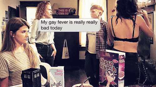 a box of choco crunch cereal sits on a table in front of a group of people