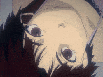 a close up of a girl 's face with her eyes looking up
