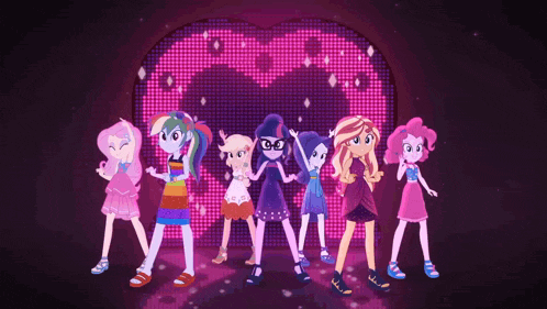 a group of girls standing in front of a heart shaped screen