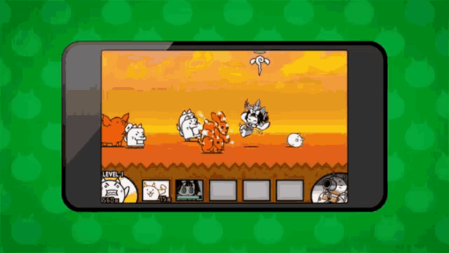 a cell phone with a game on the screen and a green background behind it