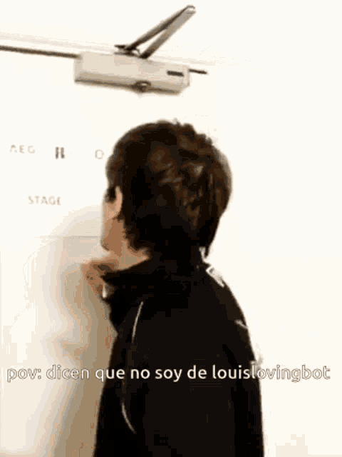 a man is standing in front of a door that says stage