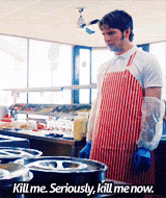 a man in an apron says " kill me seriously kill me now " in a kitchen
