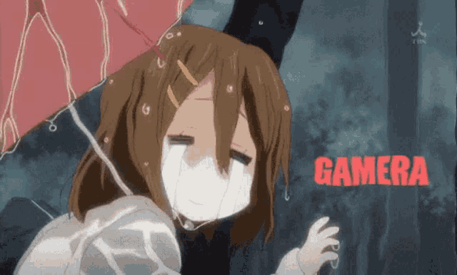 a girl is crying while holding an umbrella and the word gamera is visible behind her