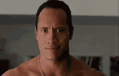 a shirtless man with a necklace around his neck is smiling .