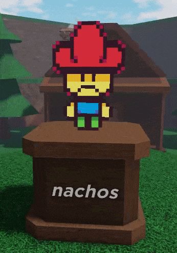 a statue of a cowboy with a red hat and the word nachos