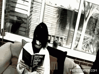 a person sitting on a couch reading a book called oxford english usage