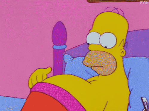 a cartoon of homer simpson laying in bed with a pink pillow