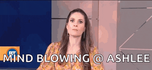 a woman is sitting in front of a screen that says mind blowing @ashlee