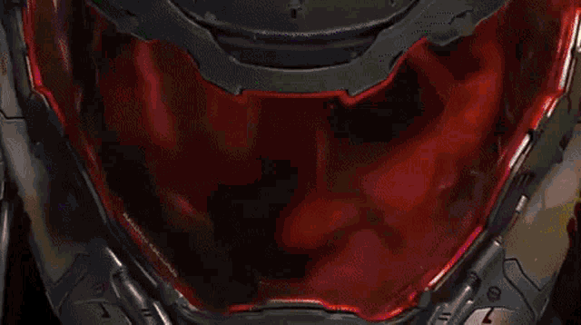a close up of a helmet with a green light coming out of it
