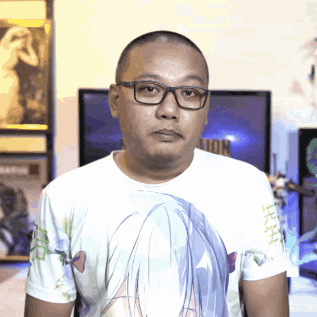 a man wearing glasses and a t-shirt with a girl 's face on it