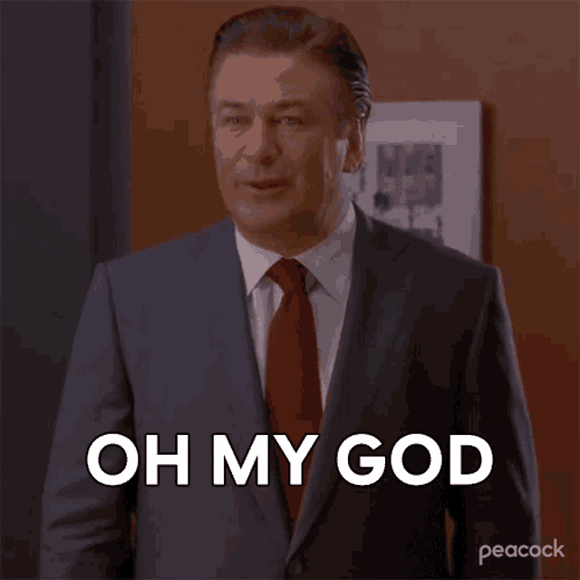 a man in a suit says oh my god