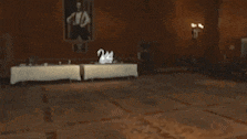 a shirtless man is standing in a room in a video game