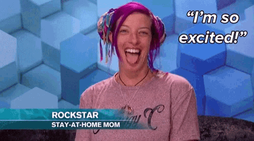 a woman with purple hair is wearing a pink shirt that says rockstar stay at home mom