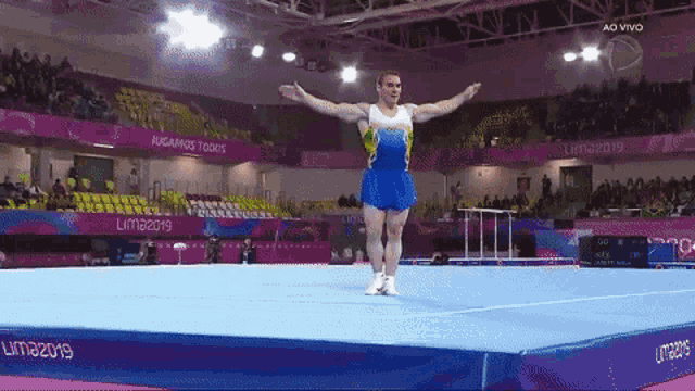 a man is doing a trick on a trampoline at the lima 2019 games