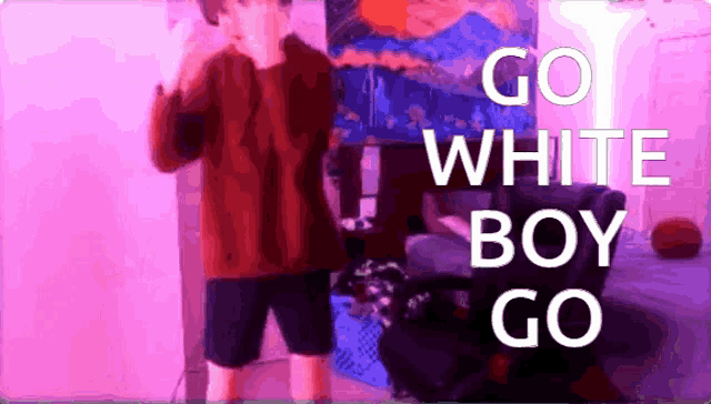 a man in a red sweater and black shorts stands in front of a pink wall with the words go white boy go on it