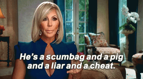 a woman in a blue dress is talking about a man in a room .