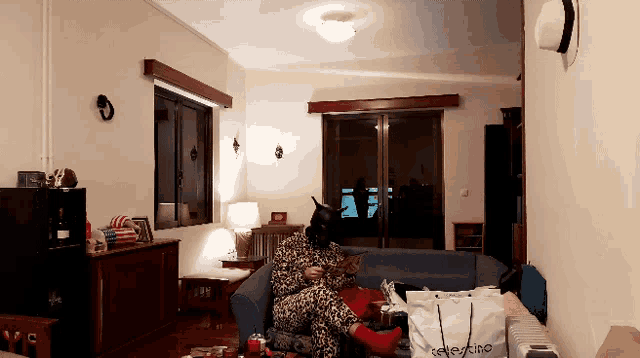 a person sitting on a couch in a living room with a selection bag