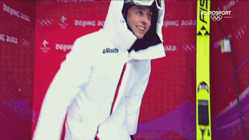 a man in a white jacket with the word eurosport on the bottom right