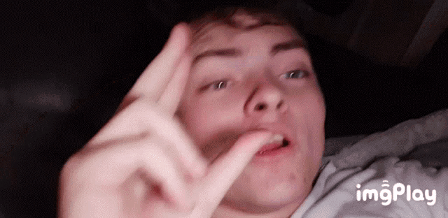 a close up of a person 's face with the words imgplay in the corner