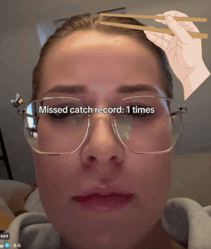a woman wearing glasses has a missed catch record of 1 times on her face