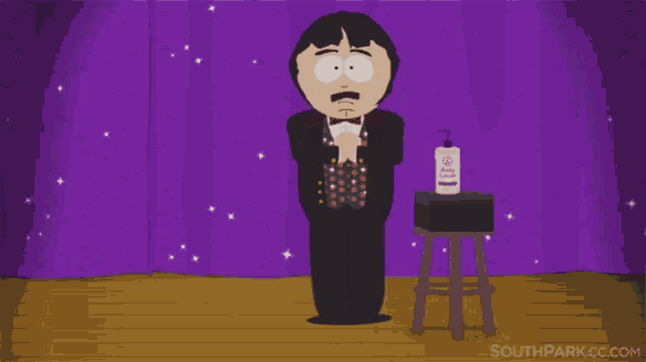 a cartoon character from south park is standing on a stage