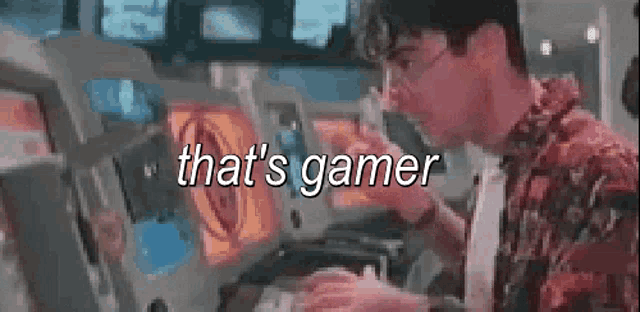 a man is playing a video game on a computer and the words that 's gamer are visible .