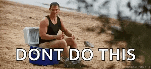 a man is sitting in a cooler on the beach with the words `` do n't do this '' written on the bottom .