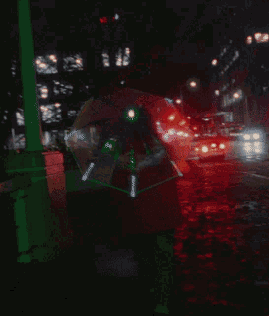 a person walking down a street at night with a sign that says ' a ' on it