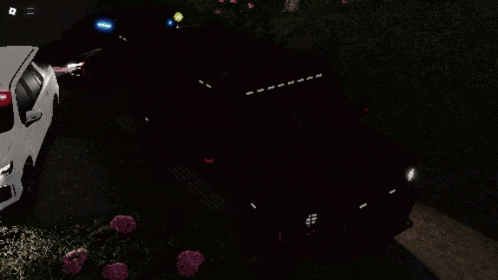 a white car is parked next to a red car with lights on