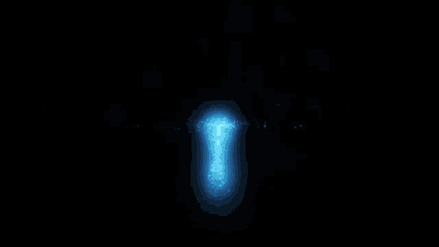 a blue light that looks like a star is coming out of the ground