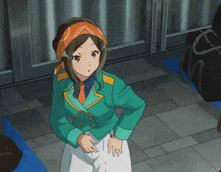 a girl in a green jacket and orange bandana
