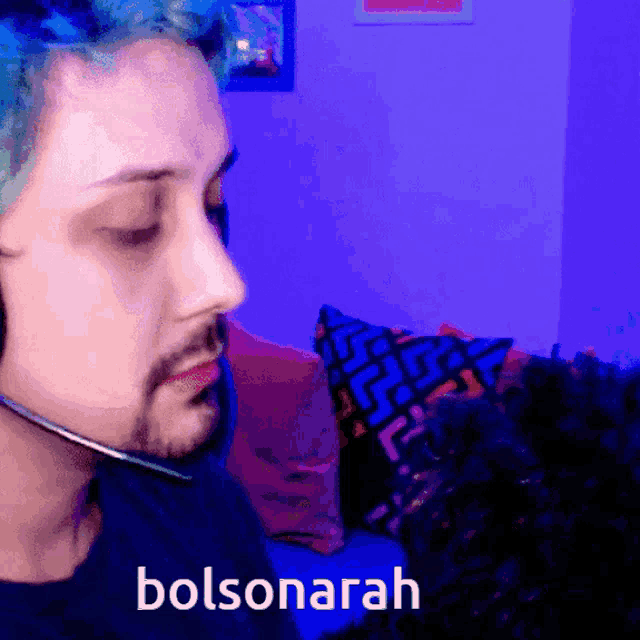 a man with blue hair is wearing a headset and the word bolsonaroh is on the bottom