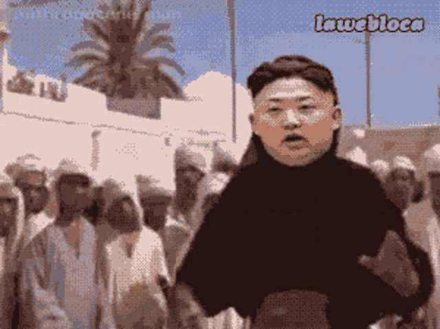 a cartoon of kim jong un standing in front of a crowd with the caption lawebloca above him