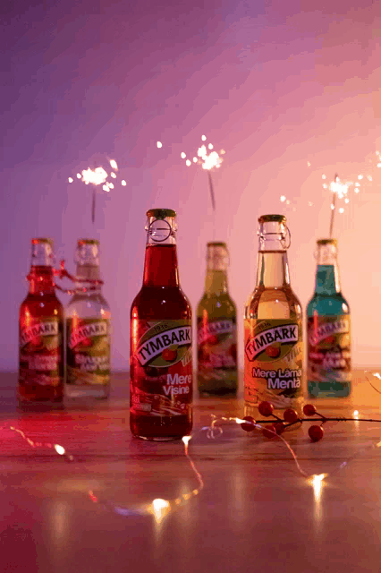 several bottles of tymbark are on a table