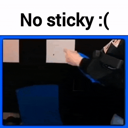 a person is pointing at a piece of paper that says `` no sticky '' on it .
