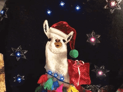 a llama is wearing a santa hat and holding a present