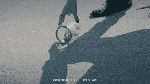 a person 's shadow is cast on the ground with the words good night little joestar above it