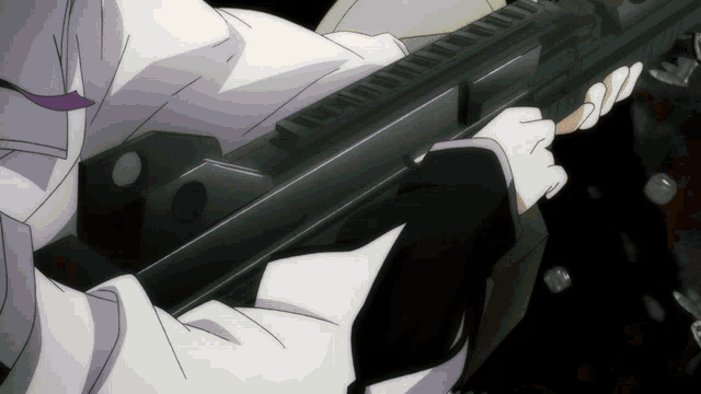 a person is holding a gun in their hand