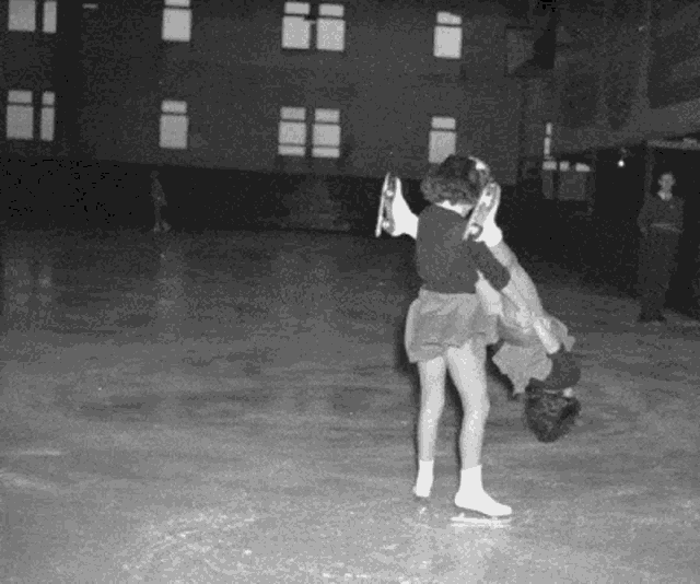 a woman is carrying another woman on her back while ice skating