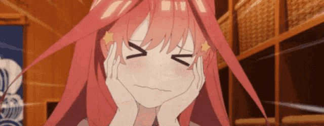 a girl with pink hair is making a funny face with her hands on her chin .