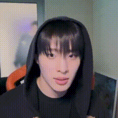 a close up of a person wearing a hooded sweatshirt .