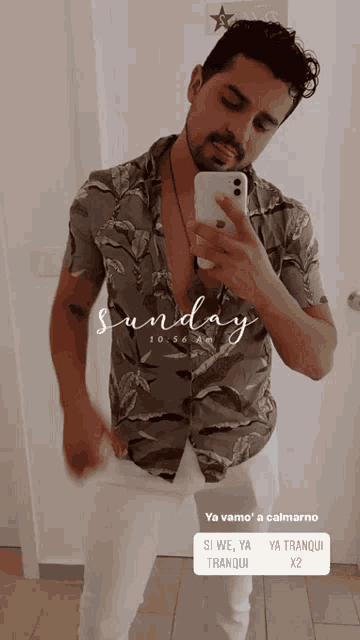 a man is taking a picture of himself in front of a sign that says sunday to go