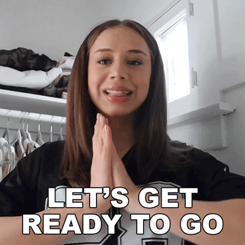 a woman says let 's get ready to go with her hands together