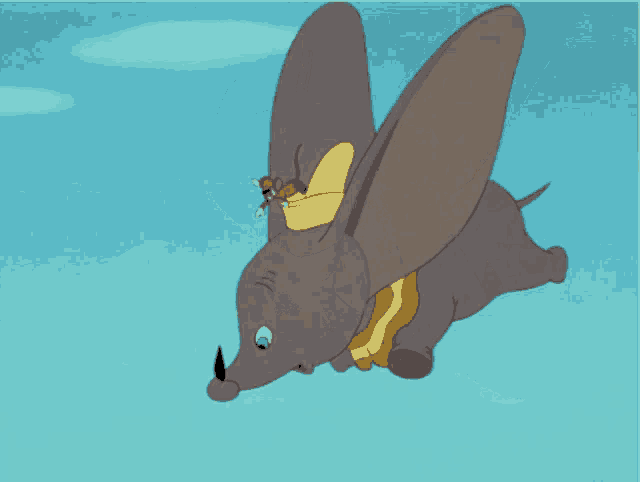 a cartoon elephant is flying through the air with mickey mouse riding on its back