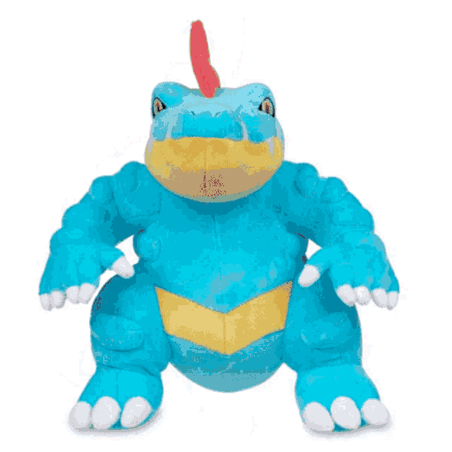 a blue and yellow stuffed crocodile with a red horn